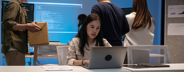 Young Asian woman working late into the night in the office, meeting, brainstorming, presentation...