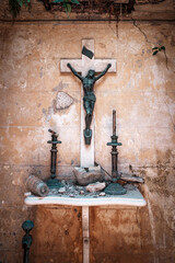 Old Crucifix on a Decayed Altar in an Abandoned Chapel