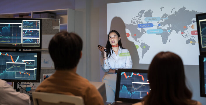 Businesswoman presents a marketing strategy using a ship route map, promoting global product distribution and sales logistics in a corporate setting during a professional presentation.