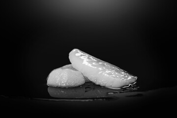 Melting Ice. A piece of melting ice on a dark