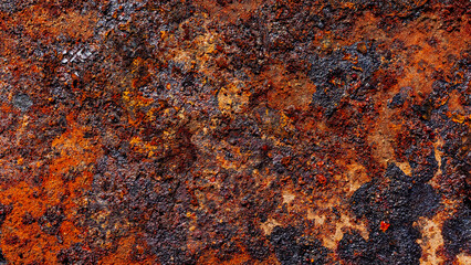 Old rust and black burnt fat on metal surface close-up, metal corrosion, grunge textured background