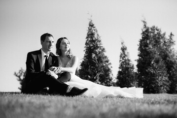 bride and groom walking in the park