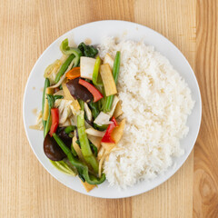 rice with vegetables stir fried mushrooms plate top view flatlay