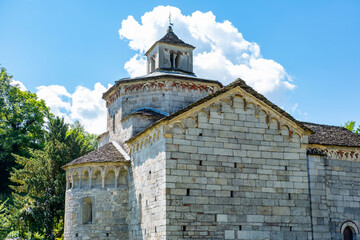Fototapeta premium Historic Church San Giovanni Battista, stone 10th church, Picturesque Italian Montorfano village Charm, Province Verbano-Cusio-Ossola region Piedmont