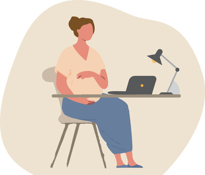 Pregnant Woman Working at Home with Laptop and Desk Lamp