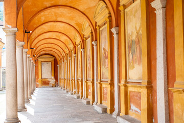 monastery corridors with arches, historic quarters, murals architecture, Roman galleries Baveno, rich Italian heritage, Italy