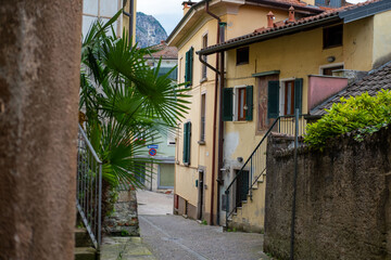 Ancient stone arches, weathered walls, medieval charm, Italian old town atmosphere, timeless travel destination region Piedmont, Old European district