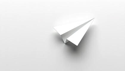 Naklejka premium A white paper airplane gliding gracefully against a light surface, perfect for concepts of flight, innovation, and dreams
