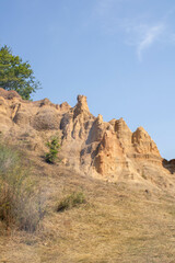 Fototapeta premium Sand Pyramids located near the city of Foča in Bosnia and Herzegovina. The Sand Pyramids are a fascinating natural phenomenon.