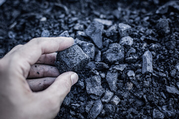 coal in the hand. Coal in the Hand of Miners. Mining Industry Concept. Heavy Industry. Heating. Mineral Raw Materials. Natural Resources