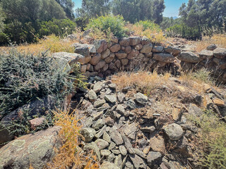Ancient stone Nuraghe ruins surrounded by nature in southern Sardinia