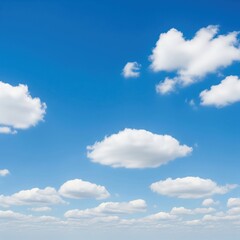 Obraz premium Vast Blue Sky with Fluffy White Clouds Scattered Across the Horizon, Creating a Serene and Expansive Natural Background for Various Designs