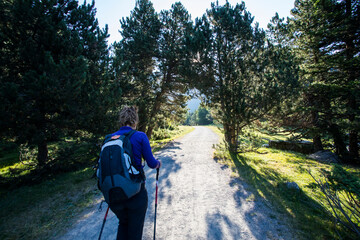 Young hiker woman in Vall de Boi, Aiguestortes and Sant Maurici National Park, Spain