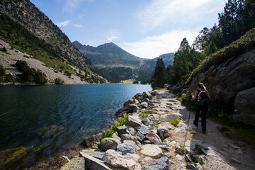 Young hiker woman in Vall de Boi, Aiguestortes and Sant Maurici National Park, Spain