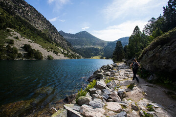 Young hiker woman in Vall de Boi, Aiguestortes and Sant Maurici National Park, Spain