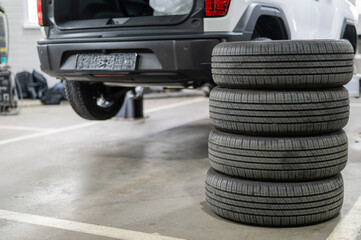 Changing tires for a car according to the season. 