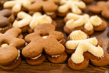Making Festive Gingerbread Sandwiches on Rustic Wooden Table