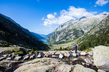 Young hiker woman in Vall de Boi, Aiguestortes and Sant Maurici National Park, Spain