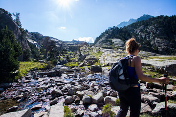 Young hiker woman in Vall de Boi, Aiguestortes and Sant Maurici National Park, Spain