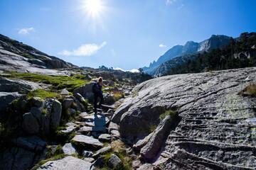 Young hiker woman in Vall de Boi, Aiguestortes and Sant Maurici National Park, Spain
