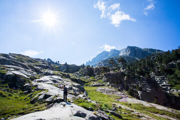 Young hiker woman in Vall de Boi, Aiguestortes and Sant Maurici National Park, Spain