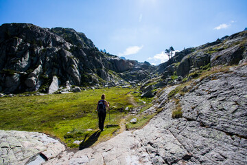 Young hiker woman in Vall de Boi, Aiguestortes and Sant Maurici National Park, Spain