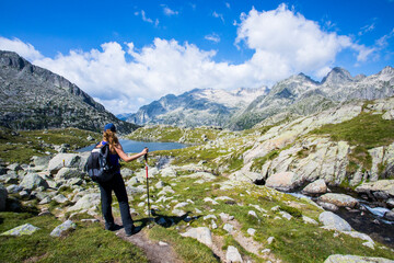 Naklejka premium Young hiker woman in Vall de Boi, Aiguestortes and Sant Maurici National Park, Spain