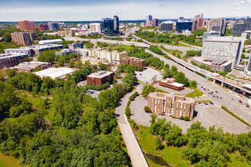 Drone view. Green streets and modern buildings in Tysons Corner in Fairfax County, Virginia, USA.