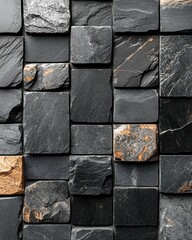 Close-up view of a patterned wall of dark gray and tan stone tiles