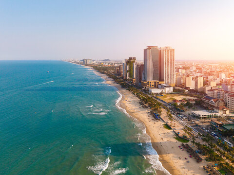 Aerial view Coastal skyline of Da nang Vietnam with sandy beaches and skyscrapers at sunset