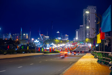 Vibrant night cityscape of Da nang Vietnam with illuminated streets and modern skyscrapers