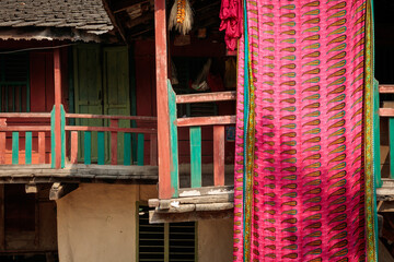 Traditional Wooden Home in Dudhauli, Nepal with Draped Fabric