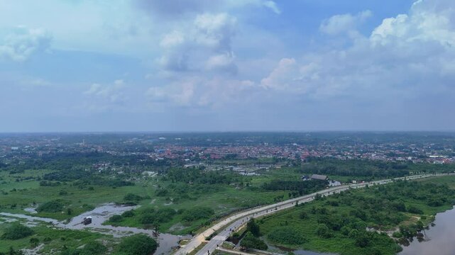 Riau, Indonesia - March 8, 2025: Aerial drone shot of Rumbai, one of the sub-districts in Pekanbaru