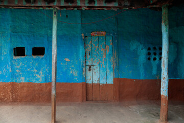 Color-Washed Mud House Facade with Faded Blue Paint – Dudhauli, Nepal