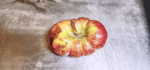 Upward photo of an odd shape apple