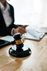 A professional lawyer advises a client in a legal office, reviewing contracts and justice symbols...