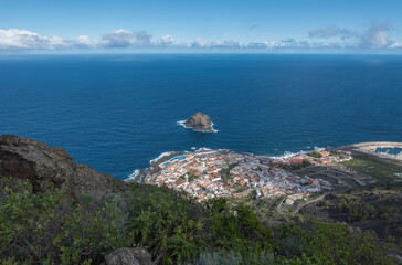 Aerial view of old town Garachico from Mirador de Garachico view point. Colorful houses and harbor. Ocean shore with lava rock pools. Popular tourist destination, Tenerife Canary Islands.