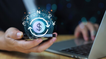 Businessman holding smartphone with Currency Exchange icons on screen. Business and Finance concept