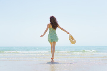 Beautiful caucasian white woman relax on the beach with surfboard. Woman in bikini's portrait with surfboard.