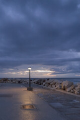 street light during blue hour after sunset on mediterranean coast in istria piran slovenia europe...