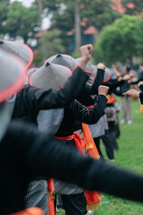 Traditional Group Dance Performance With Vibrant Costumes and Straw Hats Outdoors