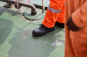 The seafarer stays on deck in coverall and safety shoes. PPE is mandatory to wear on board of offshore support vessel outside of safe accommodation areas. All seafarers are provided with PPE on board
