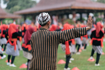 Traditional Cultural Ceremony With Participants in Colorful Costumes Outdoors