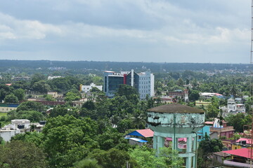 An aerial view of Agartala city under a cloudy sky. 