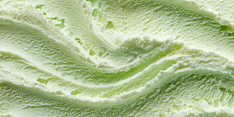 Close-up of mint sorbet texture. Frozen dessert with smooth, refreshing structure and bright green color. Appetizing surface with fine, grainy texture.