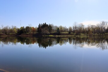The calm lake in the countryside on a sunny morning.