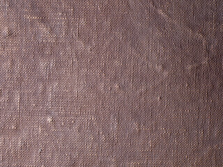 brown background painted canvas close-up