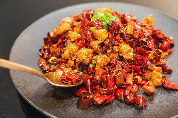 Stir-fried Mala spicy chili with deep fried chicken tendons