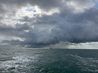 Storm clouds on the horizon whilst sailing a yacht in the Solent near the Isle of Wight