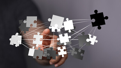 Teamwork, problem-solving, and strategic collaboration visualized with interconnected puzzle pieces.